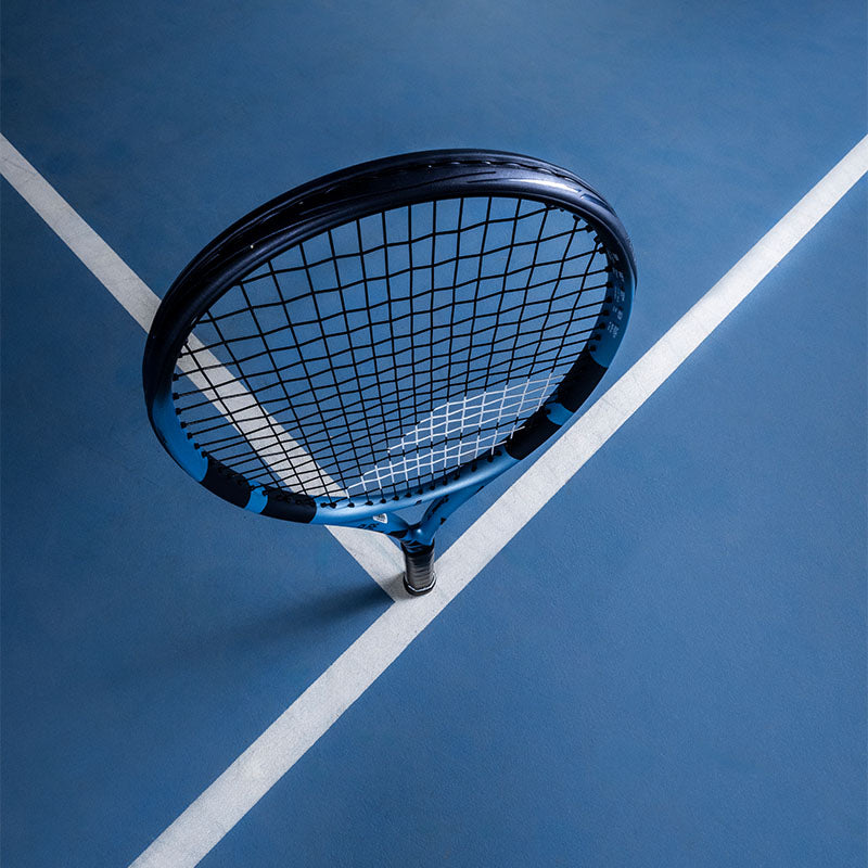 Babolat Pure Drive 2025 Tennis Racquet on a blue court
